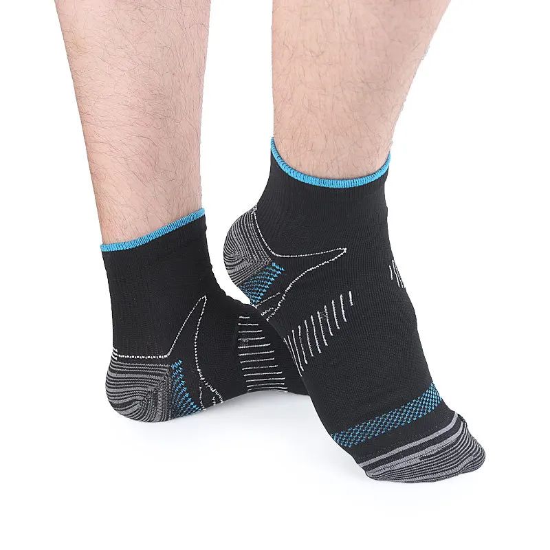 Black and aqua Heel Easy socks worn on feet